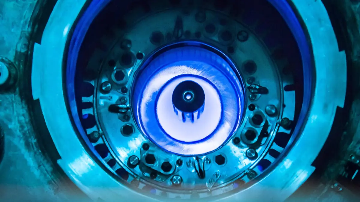 Blue Cherenkov glow in the water above the core of the High Flux Isotope Reactor, a research reactor at Oak Ridge National Laboratory, during refuelling in July 2015